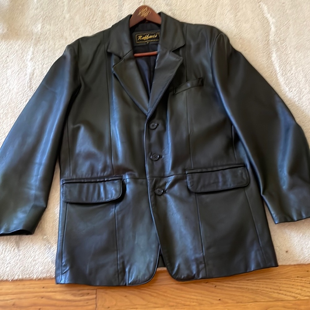 Men’s genuine leather black blazer/jacket. Three button closure.